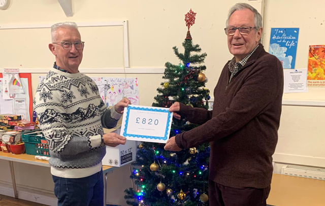 Adur concert band presents a cheque to Shoreham and Adur Community Foodbank